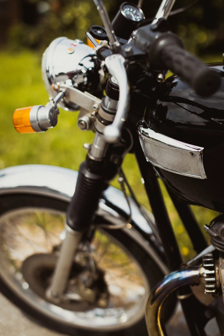 Detailed close-up of a vintage motorcycle emblem, emphasizing the precision required for R3print Moto's 3D-printed classic parts.