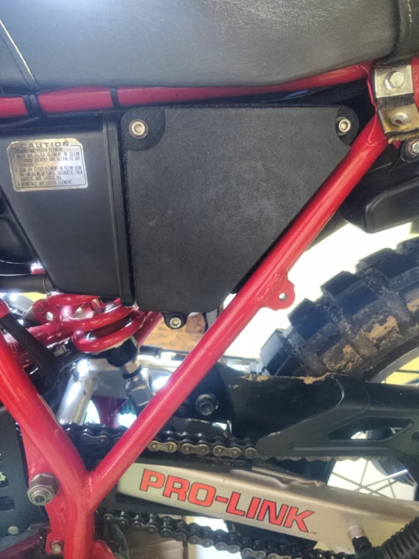 Real-world installation photo of the R3print Moto airbox lid upgrade mounted securely inside a 1983 Honda XL600R chassis frame